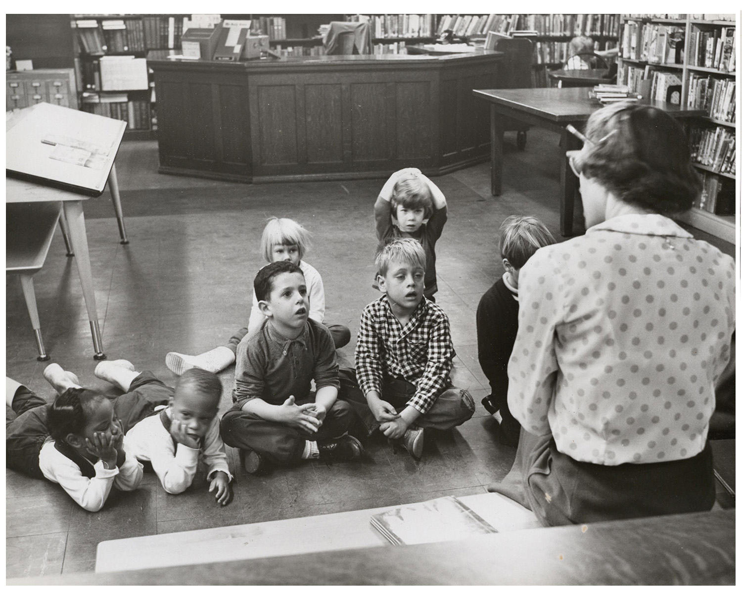 historic photo of children at story time